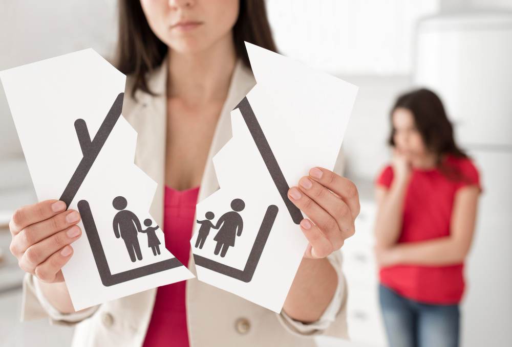 woman holding family drawing